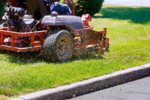 sit down exmark commercial mower cutting grass